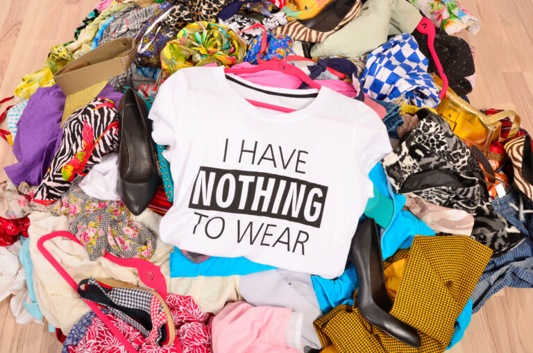Big pile of clothes thrown on the ground with a t-shirt saying n